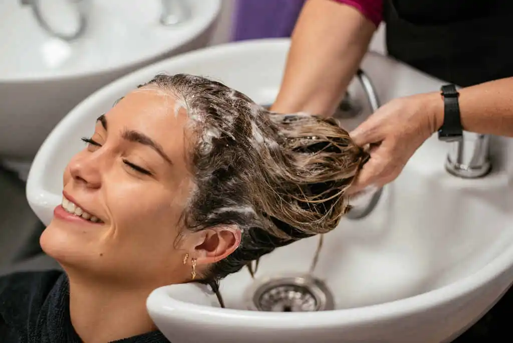 Girl using hair care products for hair