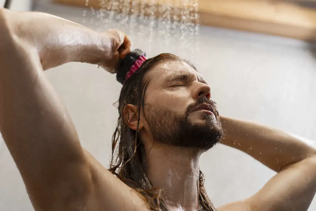 Man taking cold showers for migraines